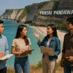 Empat mahasiswa Indonesia sedang melakukan observasi di Pantai Pandawa Bali dengan latar tebing putih dan laut biru jernih, membawa buku catatan dan laptop dalam suasana edukatif dan alam yang indah.